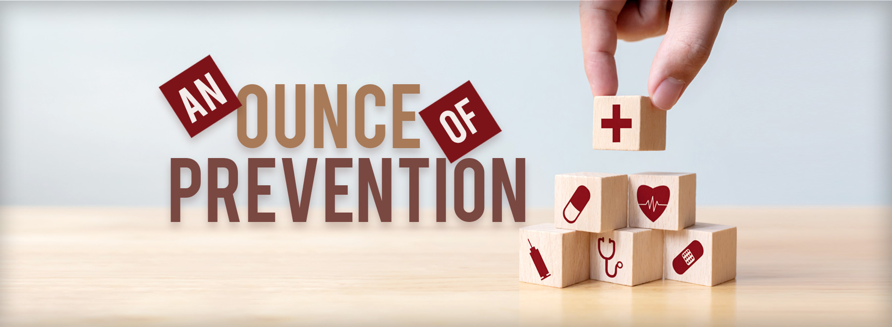 Hand with building blocks with title An ounce of prevention